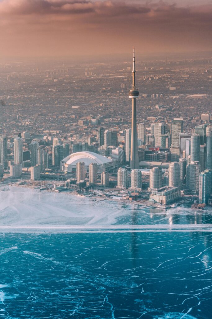 Breathtaking aerial view of the Toronto skyline with CN Tower during a winter sunset.